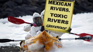 Activists of the environmental organization Greenpeace paddle their KAYAKS in front of Juanacatlan Falls in Mexico, one of the most polluted bodies of water in the country.