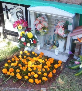 A child's crypt. Notice the toy cars and pacifier behind the glass.